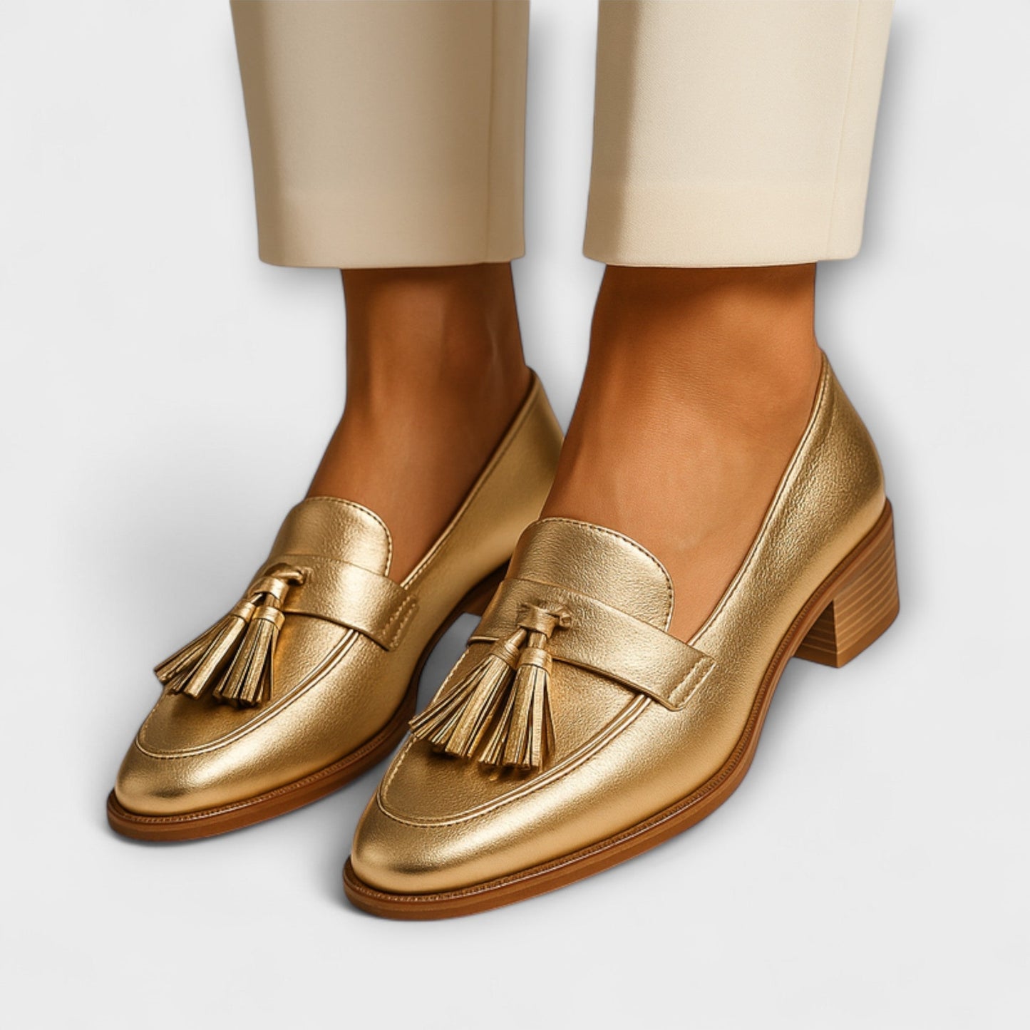 Celeste Women’s Loafers featuring elegant gold tassel accents and a stylish rounded toe design, perfect for both casual and formal occasions. 0