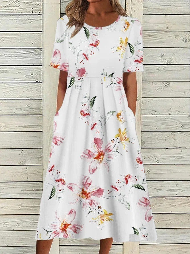 Flora Women’s Midi Dress featuring a vibrant floral print, elegantly designed with functional side pockets for practicality and style. 2