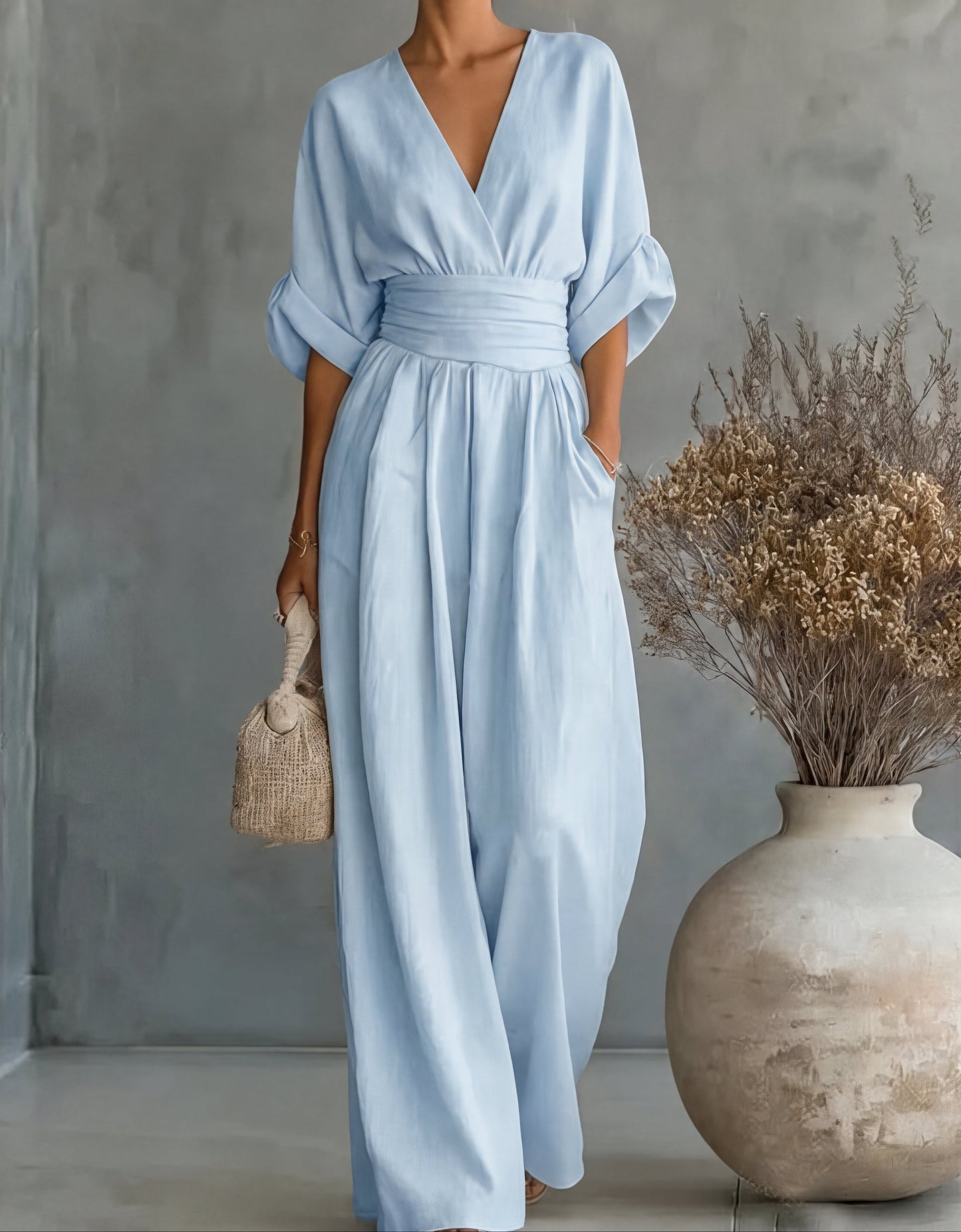 Gina Women’s Jumpsuit featuring a stylish wrap bodice and elegant wide-leg design, perfect for casual outings or special occasions. 15