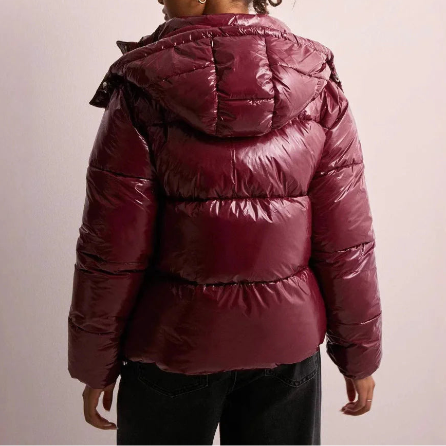 Wynna Women's Quilted Puffer Coat featuring lightweight insulation and a stylish hood, perfect for staying warm and fashionable during winter outings. 4