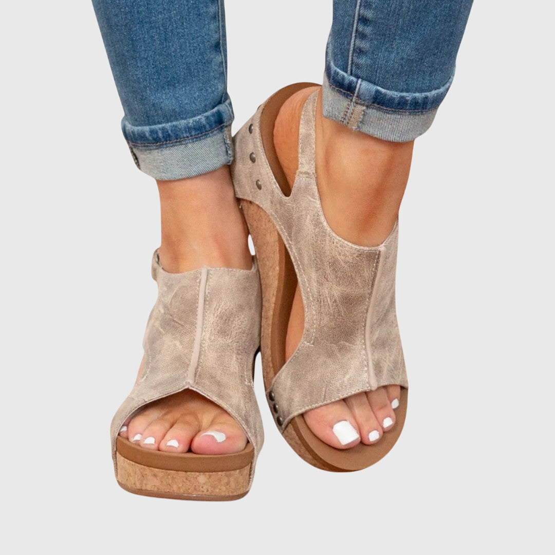 Adela Women’s Sandals featuring an adjustable buckle and a lightweight wedge design, perfect for comfort and style. 1