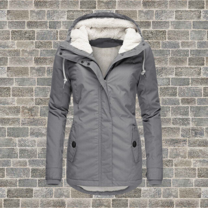Adelaide Women’s Coat featuring a hood and stylish pleated detailing, perfect for chic and cozy winter looks. 0