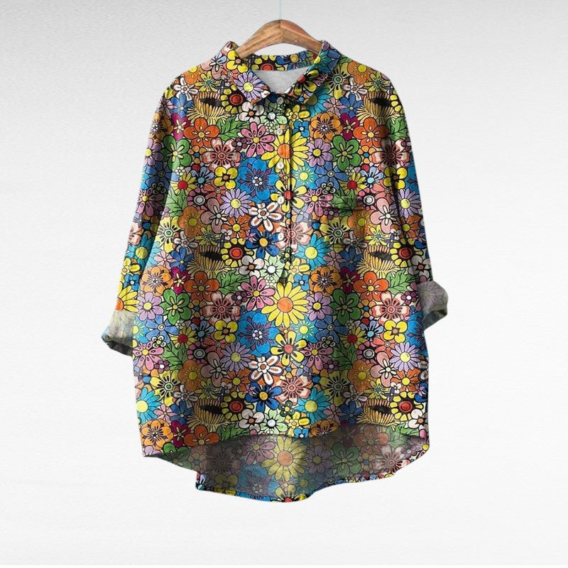 Adira Women’s Blouse featuring a vibrant floral pattern and convenient pocket detail, perfect for casual or semi-formal occasions. 0