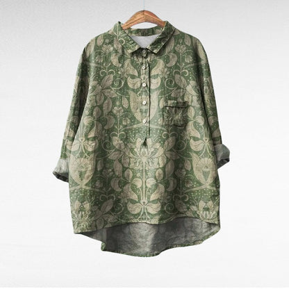 Adira Women’s Blouse featuring a vibrant floral pattern and convenient pocket detail, perfect for casual or semi-formal occasions. 1