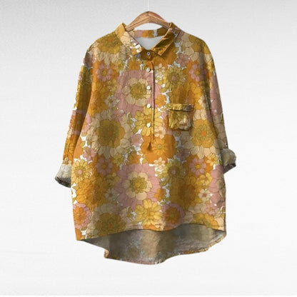Adira Women’s Blouse featuring a vibrant floral pattern and convenient pocket detail, perfect for casual or semi-formal occasions. 2