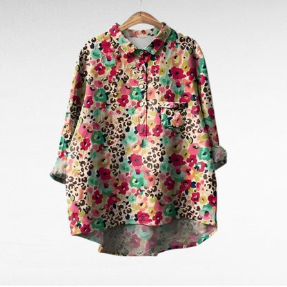 Adira Women’s Blouse featuring a vibrant floral pattern and convenient pocket detail, perfect for casual or semi-formal occasions. 4