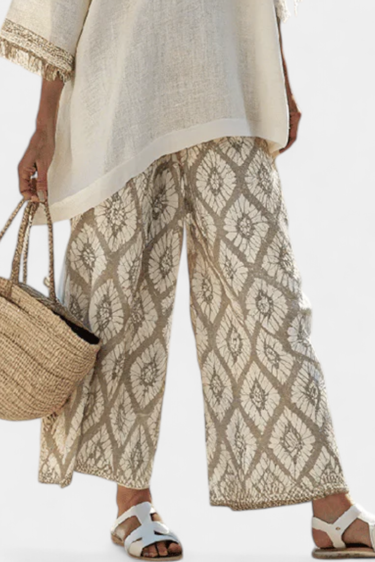 Alverra Women’s Outfit featuring stylish fringe accents and ethnic print trousers, perfect for a trendy and bohemian look. 2