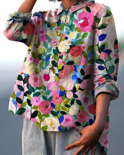 Aura Women's Blouse featuring a stylish abstract floral print and a button front design, perfect for casual or semi-formal occasions. 1