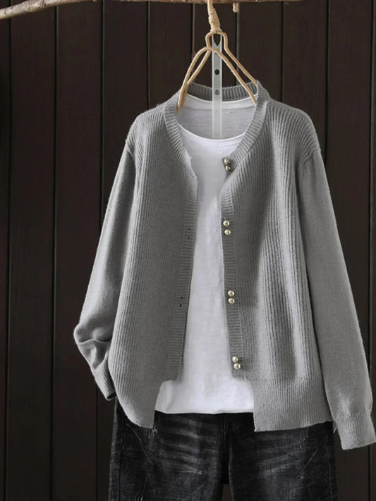 Auri Women’s Cardigan featuring elegant pearl-inspired buttons and a relaxed fit, perfect for stylish layering in any season. 0