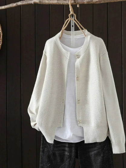 Auri Women’s Cardigan featuring elegant pearl-inspired buttons and a relaxed fit, perfect for stylish layering in any season. 4