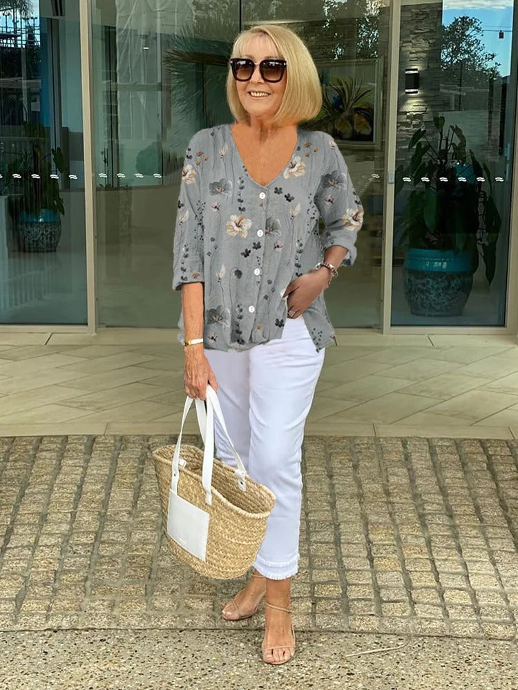 Bella Women’s Blouse featuring a stylish V-neckline and three-quarter sleeves, designed with a vibrant all-over print for a chic and fashionable look. 3