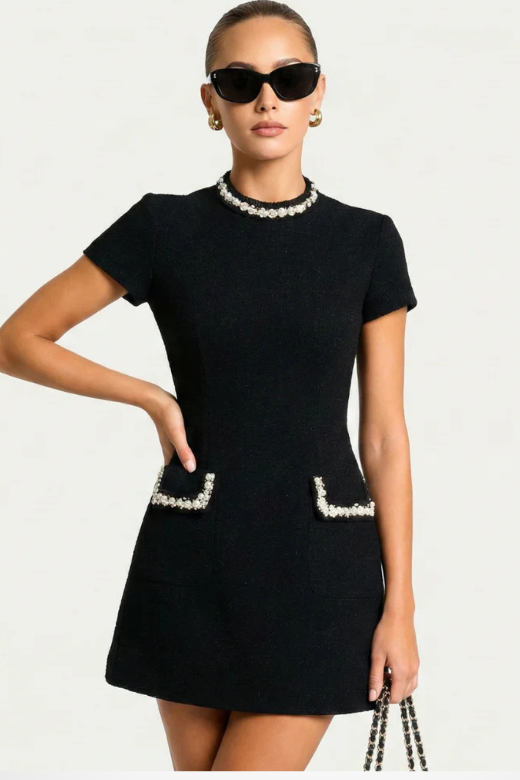 Elegant Bella Women’s Dress featuring stylish pearl-trimmed pockets and short sleeves, perfect for casual outings or special occasions. 3