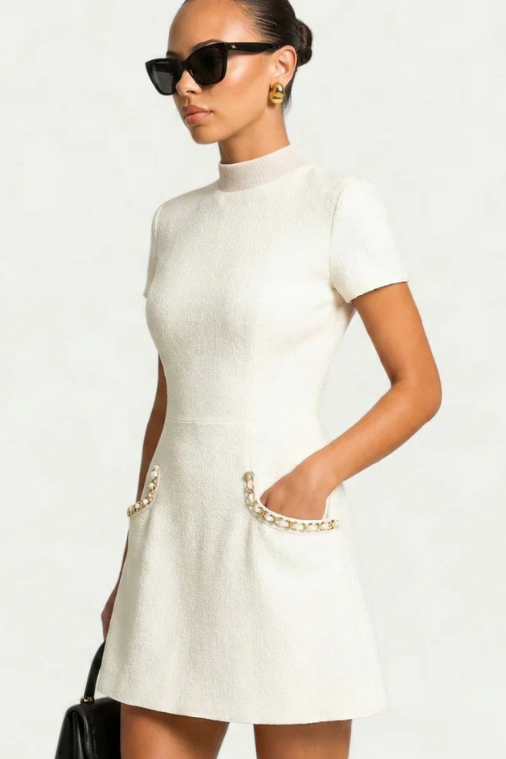 Elegant Bella Women’s Dress featuring stylish pearl-trimmed pockets and short sleeves, perfect for casual outings or special occasions. 5
