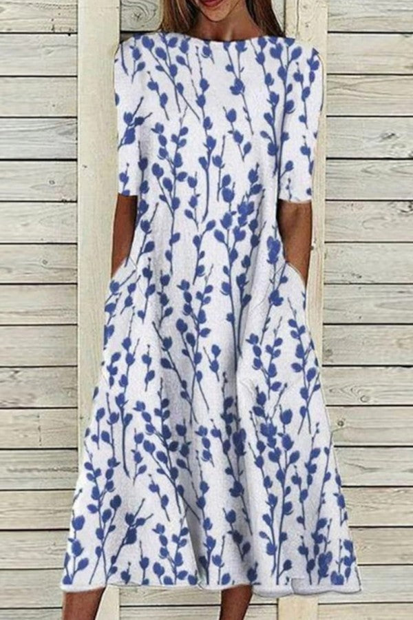 Bella Women’s Midi Dress featuring a vibrant botanical print and stylish half sleeves, perfect for spring and summer occasions. 0