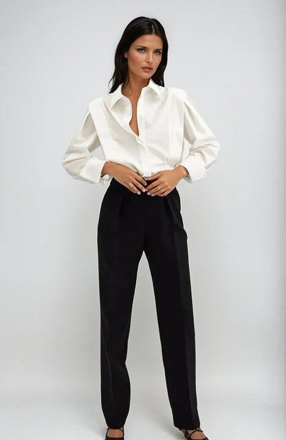 Bella Women's button-down shirt available in multiple colors, featuring a stylish and versatile design perfect for any occasion. 1