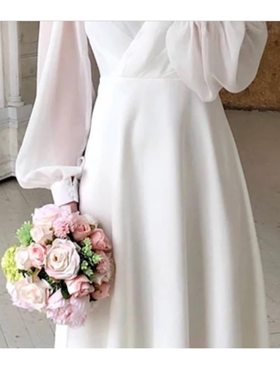 Elegant Bella Women's Wedding Dress featuring classic long sleeves and a flowing design, perfect for brides seeking timeless beauty on their special day. 2