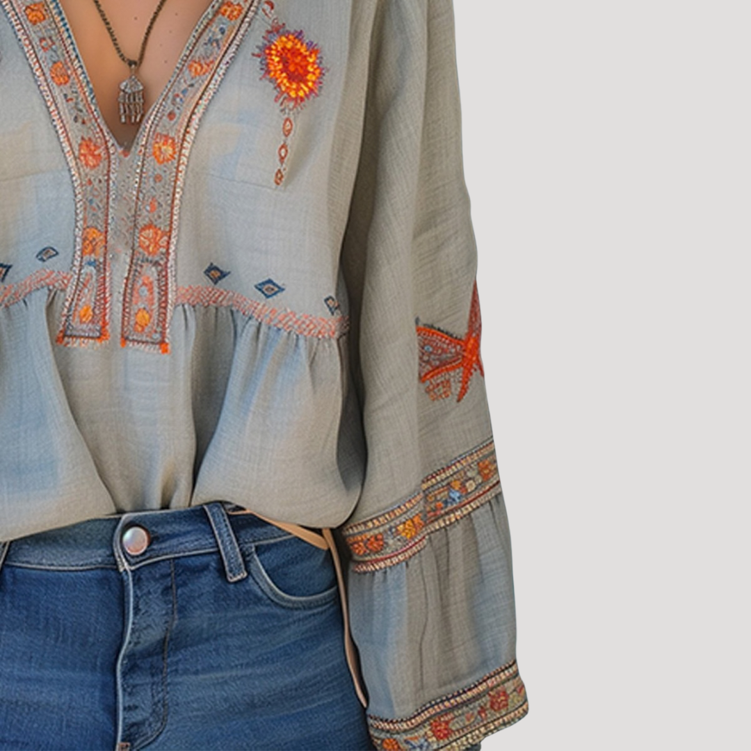 Breezy blouse featuring intricate floral embroidery and a stylish V-neck design, perfect for a casual yet elegant look. 4