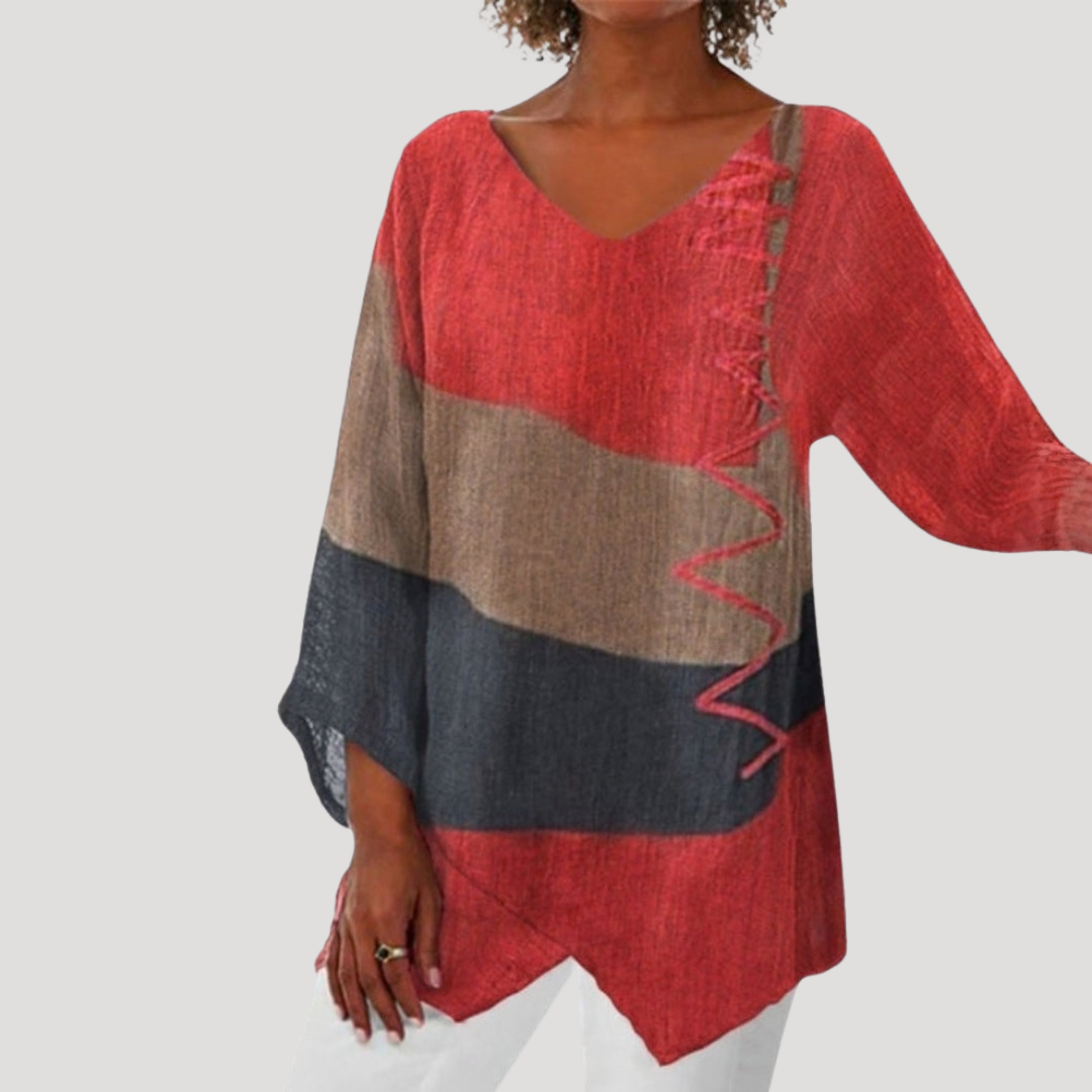 Breezy tunic top for women featuring a stylish V-neck and trendy color block design, perfect for casual and comfortable wear. 0