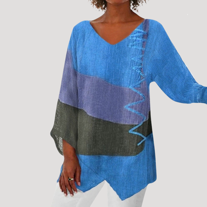 Breezy tunic top for women featuring a stylish V-neck and trendy color block design, perfect for casual and comfortable wear. 1