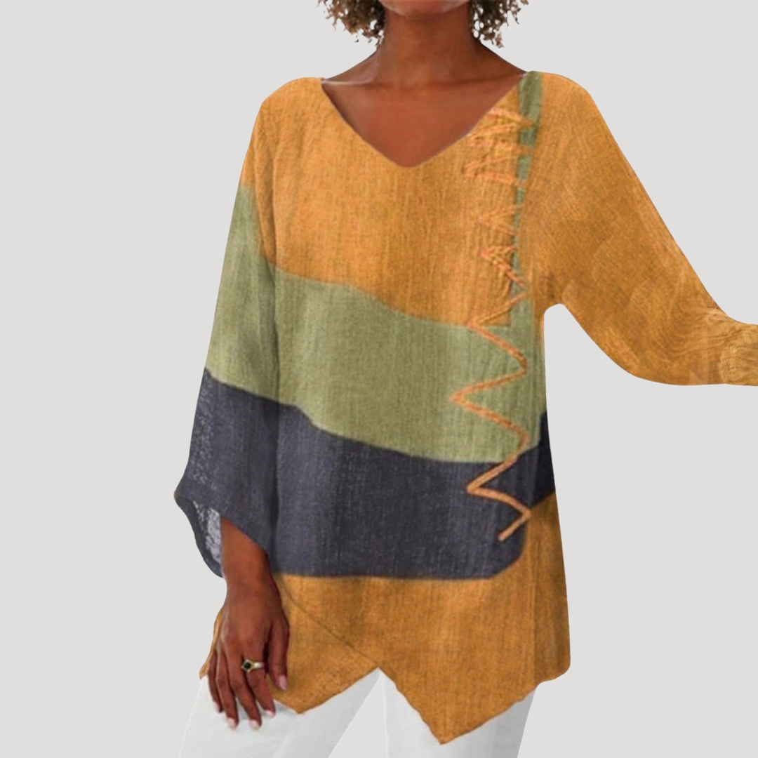 Breezy tunic top for women featuring a stylish V-neck and trendy color block design, perfect for casual and comfortable wear. 2