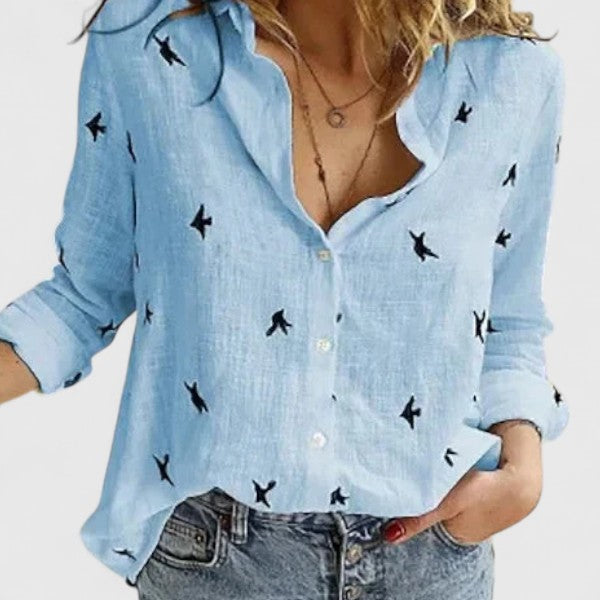Breezy women’s shirt featuring a soft wavy lapel collar and button-down front, perfect for casual or semi-formal occasions. 11