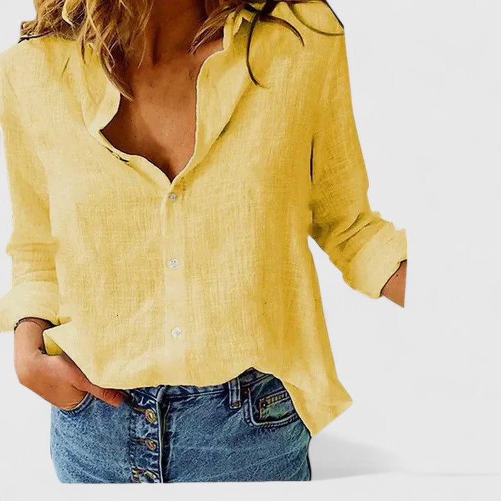 Breezy women’s shirt featuring a soft wavy lapel collar and button-down front, perfect for casual or semi-formal occasions. 5