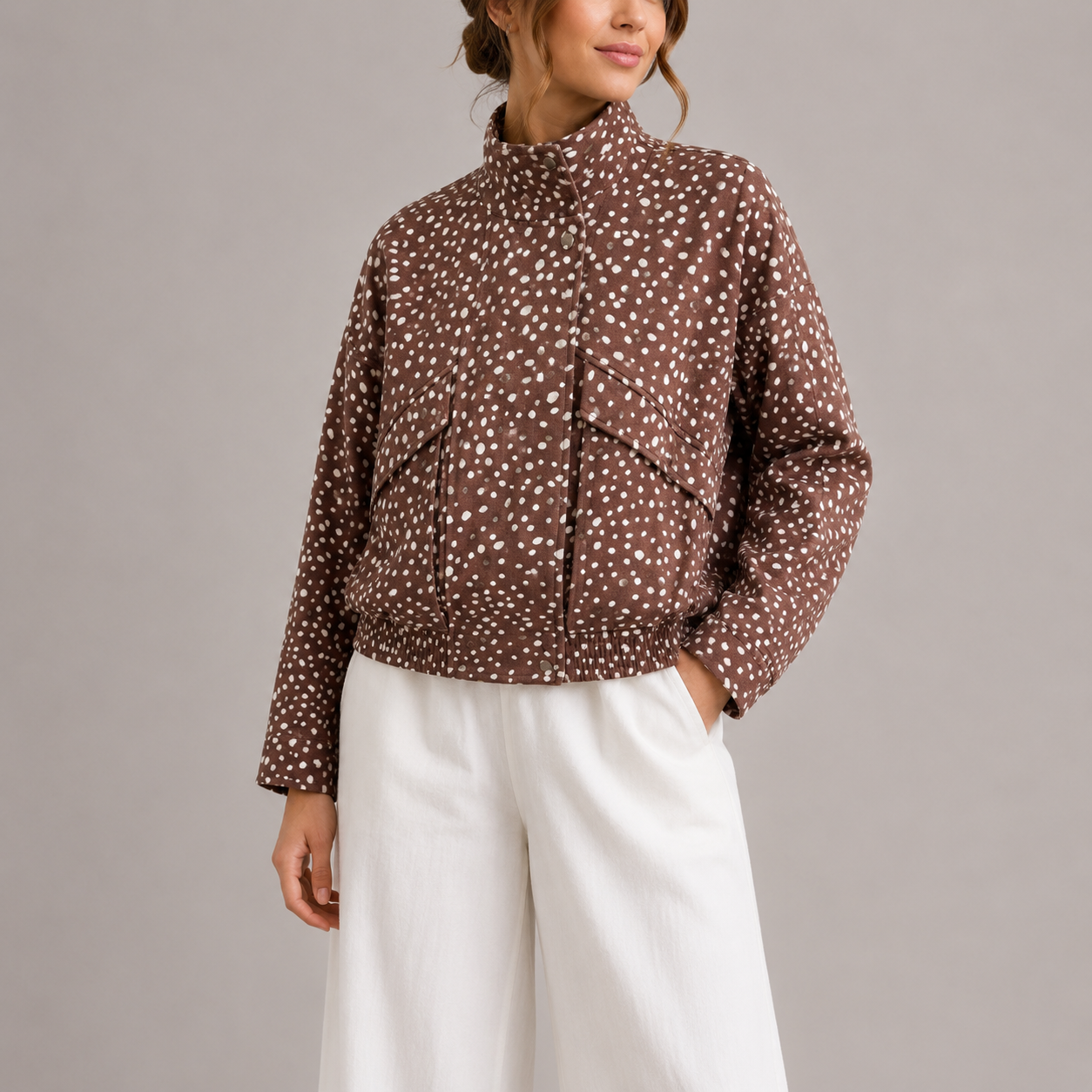 Bryn Women's Cropped Bomber Jacket in brown with polka dot pattern and high neck design, perfect for stylish layering in cooler weather. 0