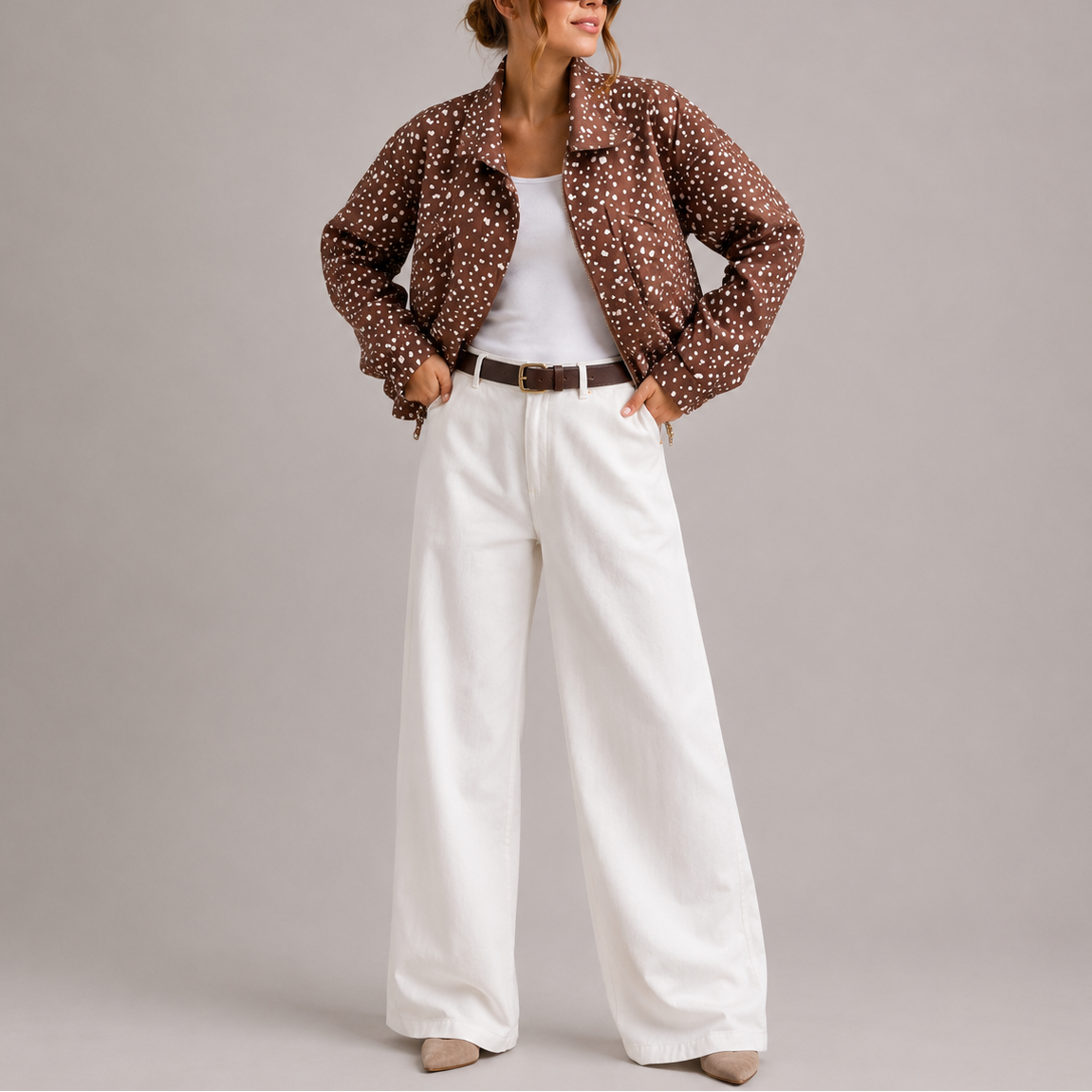 Bryn Women's Cropped Bomber Jacket in brown with polka dot pattern and high neck design, perfect for stylish layering in cooler weather. 1