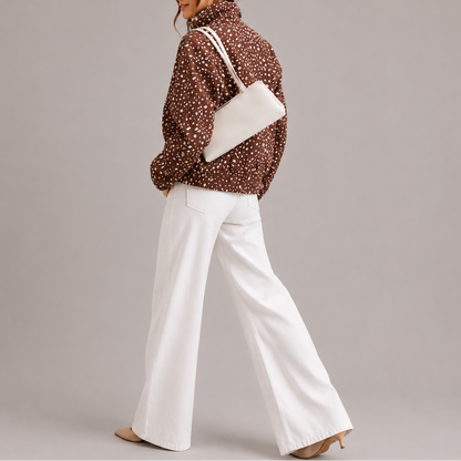 Bryn Women's Cropped Bomber Jacket in brown with polka dot pattern and high neck design, perfect for stylish layering in cooler weather. 2