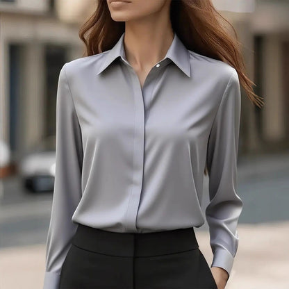 Chic women's blouse featuring a classic collar and elegant button details, perfect for stylish casual or professional outfits. 1