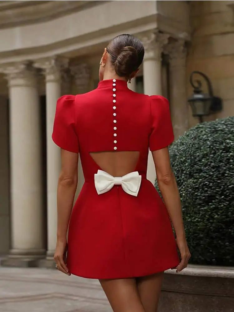 Chic women’s mini dress featuring padded shoulders and a stylish bow detail, perfect for trendy summer outings and special occasions. 5
