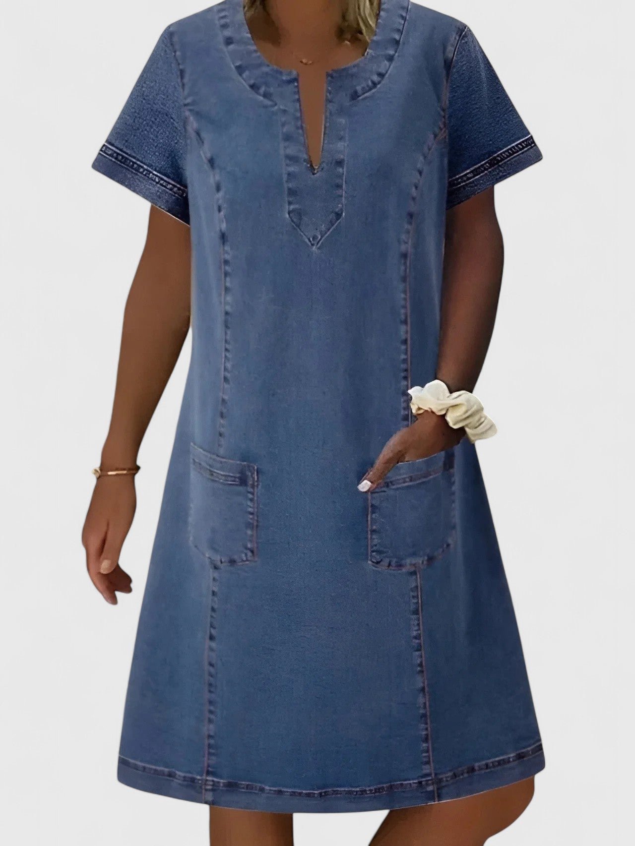 Christine Women’s Denim Dress featuring a relaxed silhouette, stylish front pockets, and a versatile design perfect for casual outings. 0