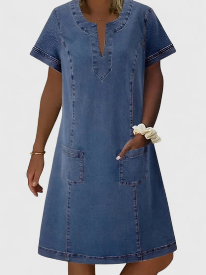 Christine Women’s Denim Dress featuring a relaxed silhouette, stylish front pockets, and a versatile design perfect for casual outings. 0