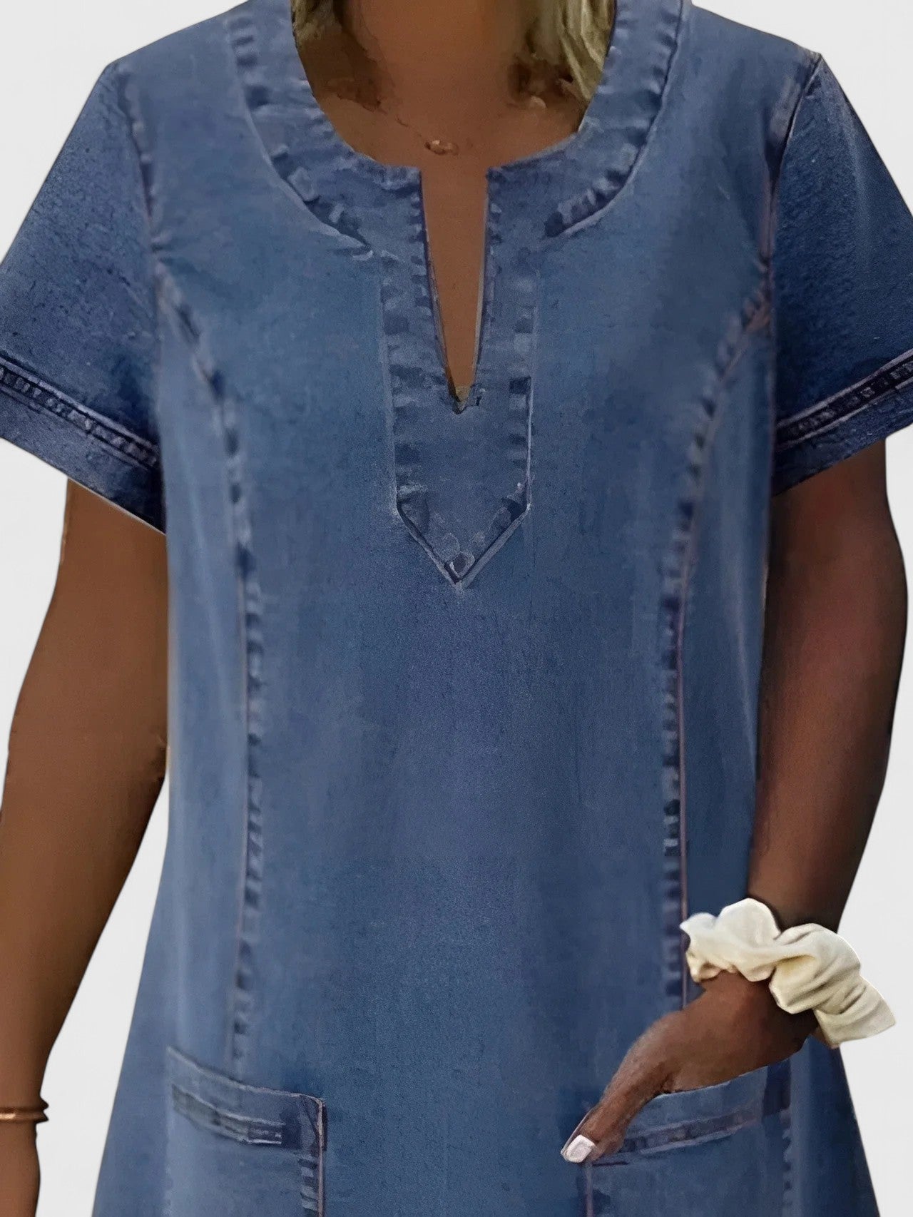 Christine Women’s Denim Dress featuring a relaxed silhouette, stylish front pockets, and a versatile design perfect for casual outings. 1