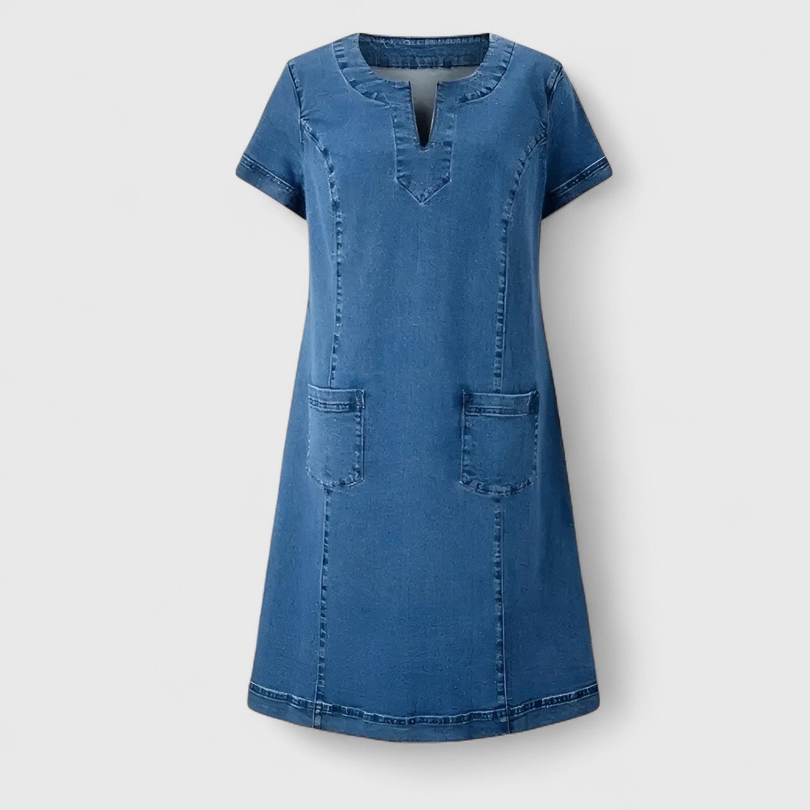 Christine Women’s Denim Dress featuring a relaxed silhouette, stylish front pockets, and a versatile design perfect for casual outings. 2