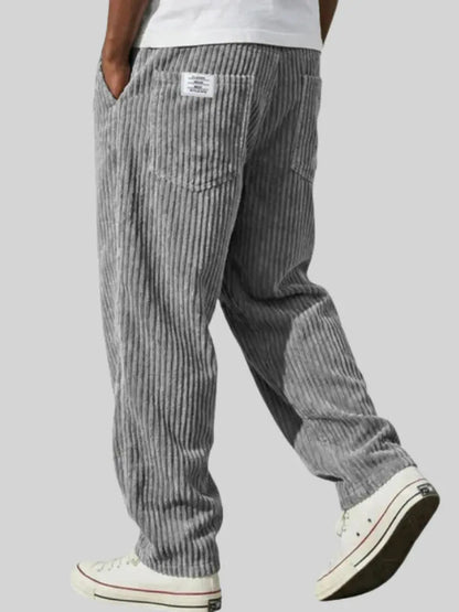 Dapper casual pants for men featuring an elastic waistband and functional pockets, perfect for comfortable and stylish everyday wear. 0