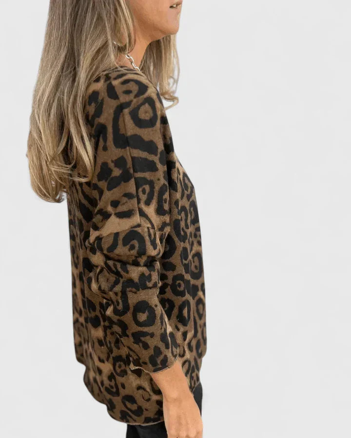 Eda Women’s Top featuring a stylish leopard print design and a comfortable relaxed fit, perfect for casual wear. 1