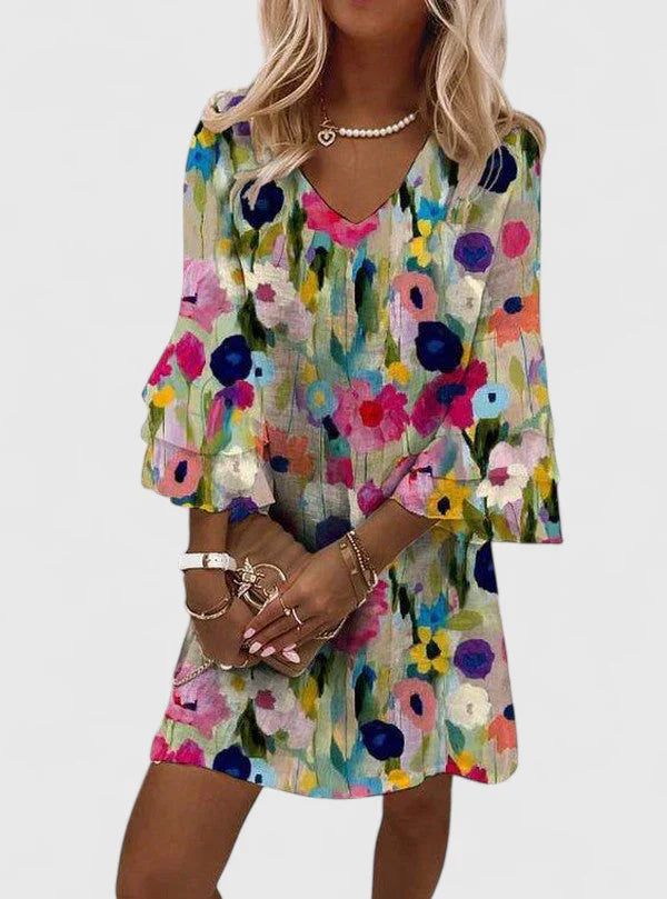 Elysia Women’s Mini Dress featuring a vibrant floral print and stylish V-neckline, perfect for summer outings and casual events. 0