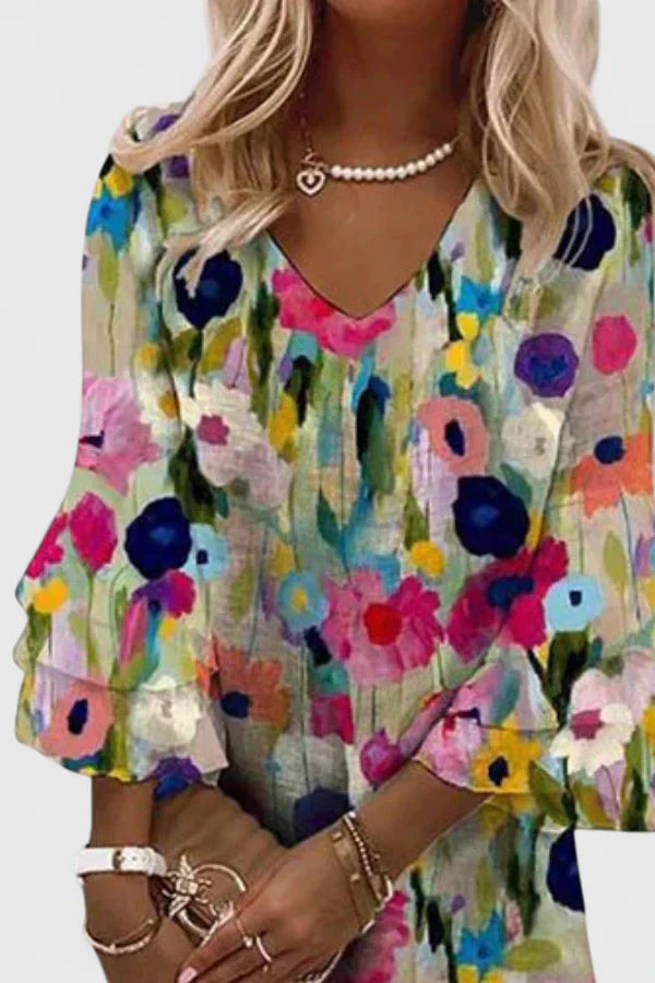 Elysia Women’s Mini Dress featuring a vibrant floral print and stylish V-neckline, perfect for summer outings and casual events. 2