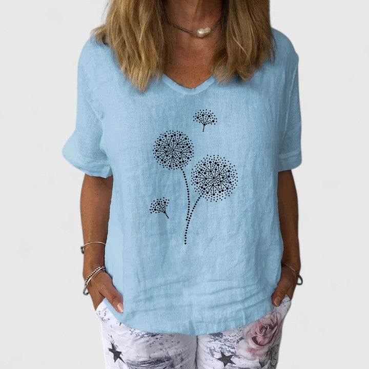 Elysia Women’s Summer Blouse featuring a loose fit design and vibrant casual print, perfect for warm weather outings. 0