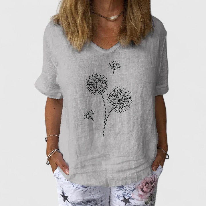 Elysia Women’s Summer Blouse featuring a loose fit design and vibrant casual print, perfect for warm weather outings. 1