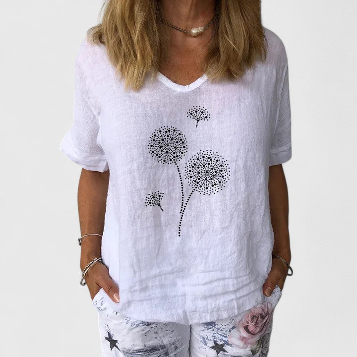 Elysia Women’s Summer Blouse featuring a loose fit design and vibrant casual print, perfect for warm weather outings. 2