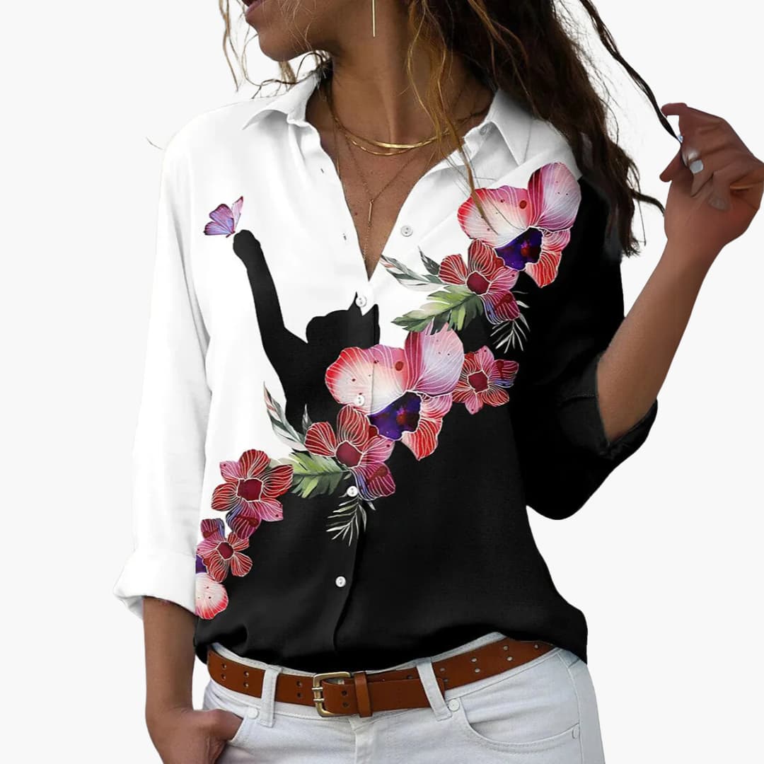 Flora Women’s Blouse featuring a vibrant colorblock floral design and a flattering cut, perfect for stylish casual wear. 2