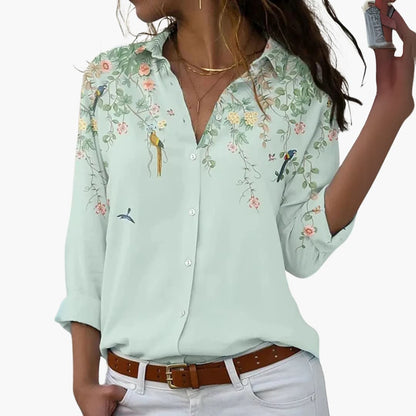 Flora Women’s Blouse featuring a vibrant colorblock floral design and a flattering cut, perfect for stylish casual wear. 3