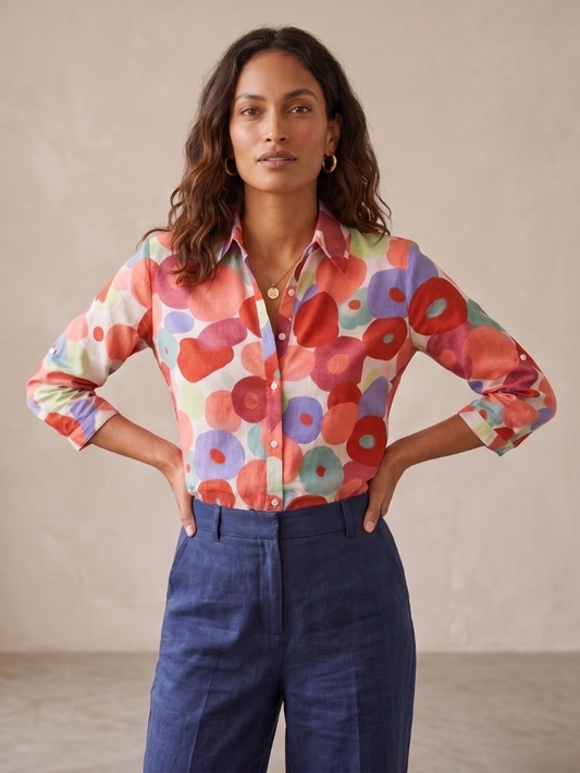 Flora Women’s Blouse featuring a vibrant floral design, long sleeves with roll-tabs, perfect for casual or office wear. 0