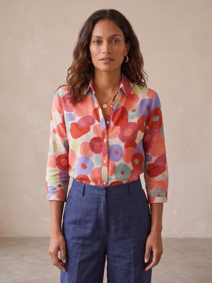 Flora Women’s Blouse featuring a vibrant floral design, long sleeves with roll-tabs, perfect for casual or office wear. 1
