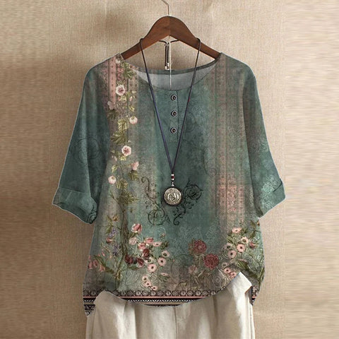 Flora Women's blouse featuring a vintage floral print and short sleeves, perfect for a stylish and feminine look. 0