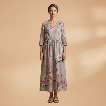 Flora Women’s Dress featuring a V-neck design and a flowing skirt adorned with a vibrant floral pattern, perfect for summer outings and special occasions. 0