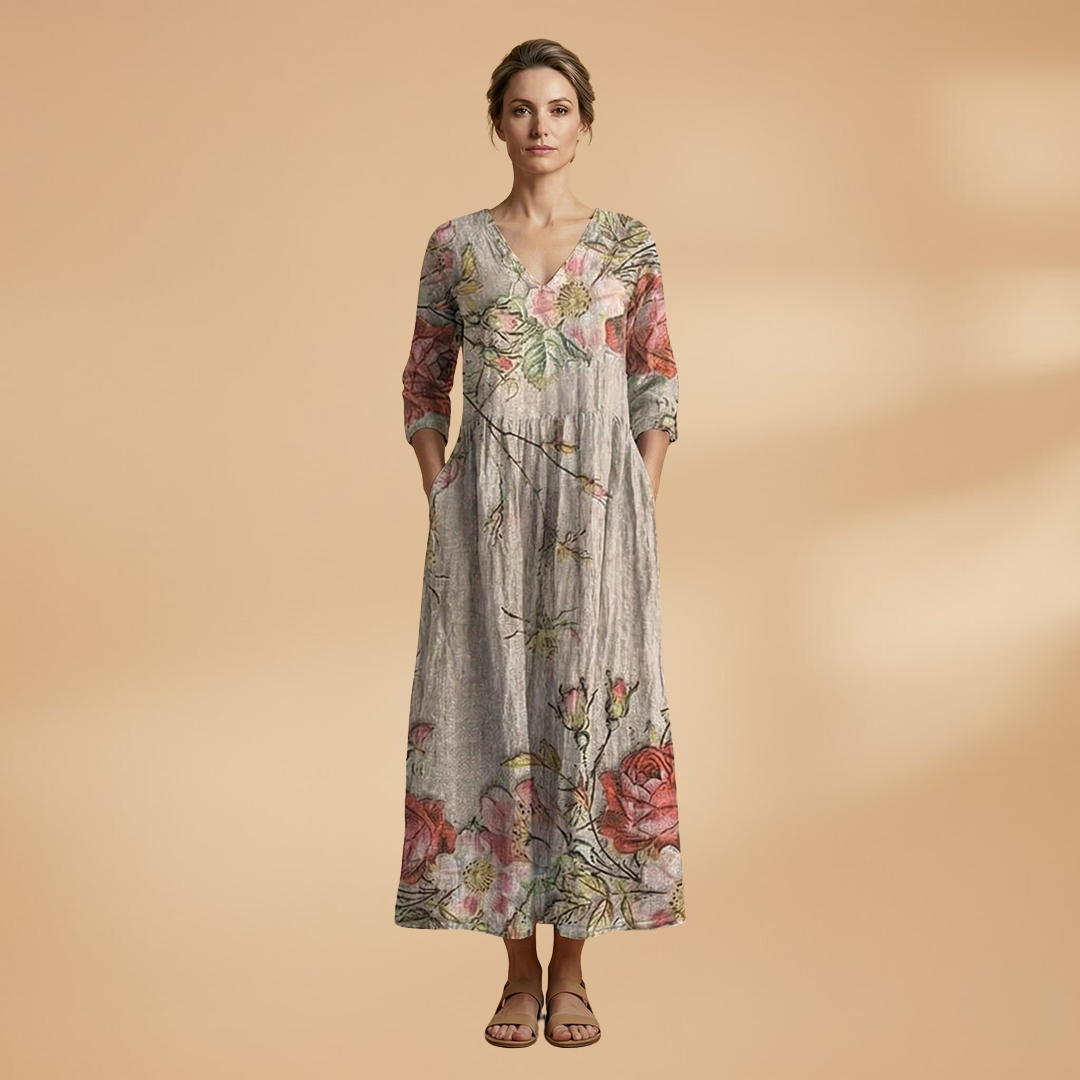 Flora Women’s Dress featuring a V-neck design and a flowing skirt adorned with a vibrant floral pattern, perfect for summer outings and special occasions. 11