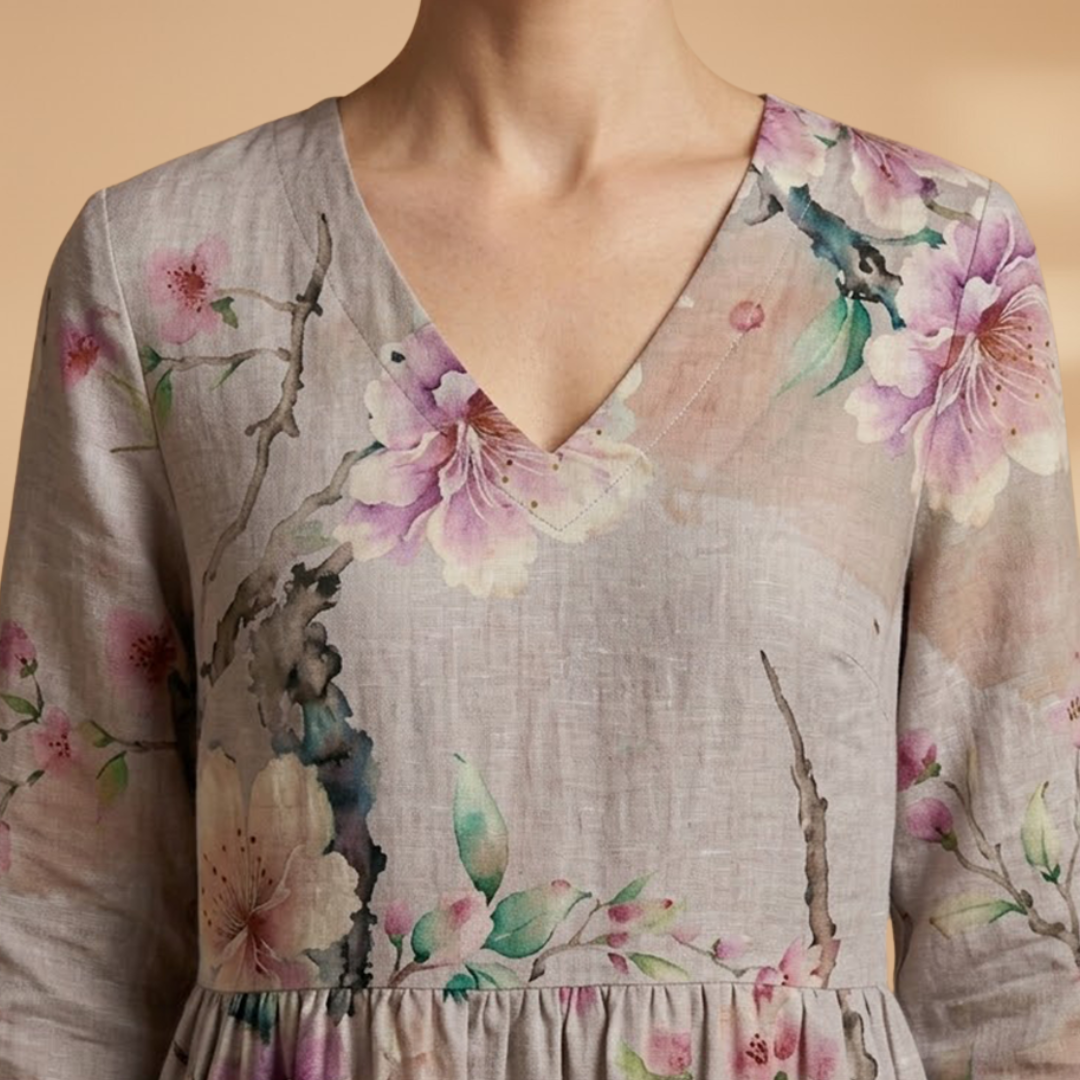 Flora Women’s Dress featuring a V-neck design and a flowing skirt adorned with a vibrant floral pattern, perfect for summer outings and special occasions. 5